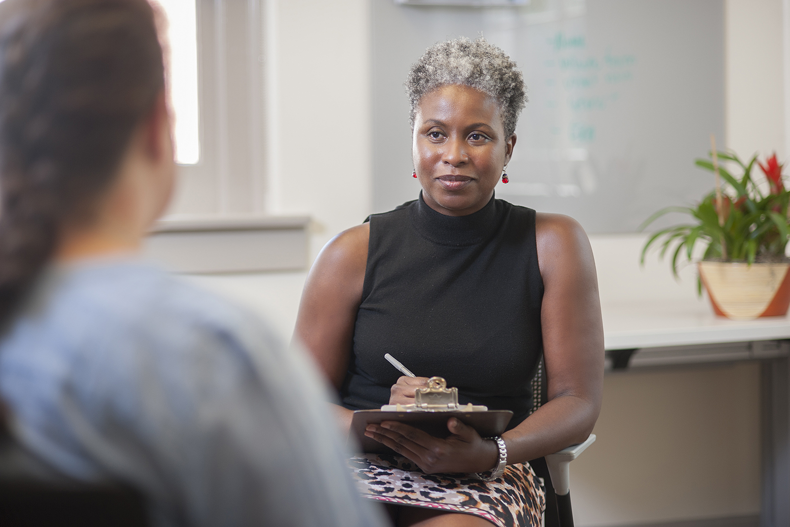 Janice Harewood, licensed psychologist and assistant director for Outreach and Wellness, talks with a student in the Counseling Center.